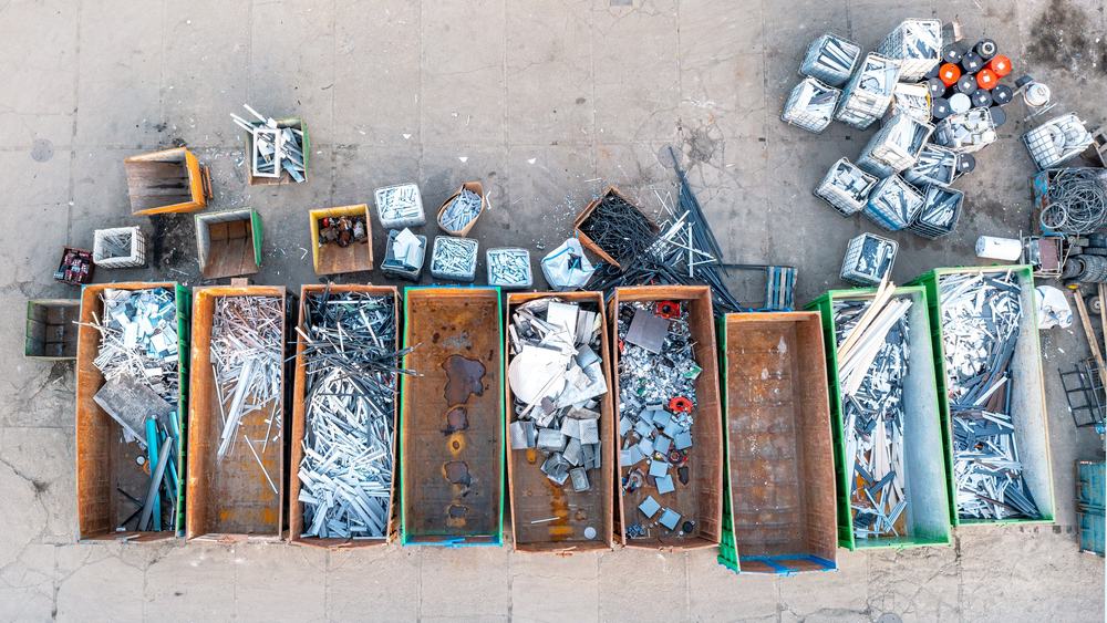 row of containers holding different types of scrap metal